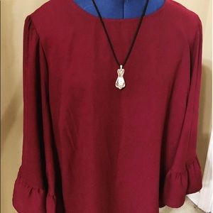 Women’s blouse with flowing sleeves
